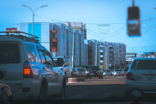 A busy street in Lisbon with modern transport vehicles and clear blue sky.