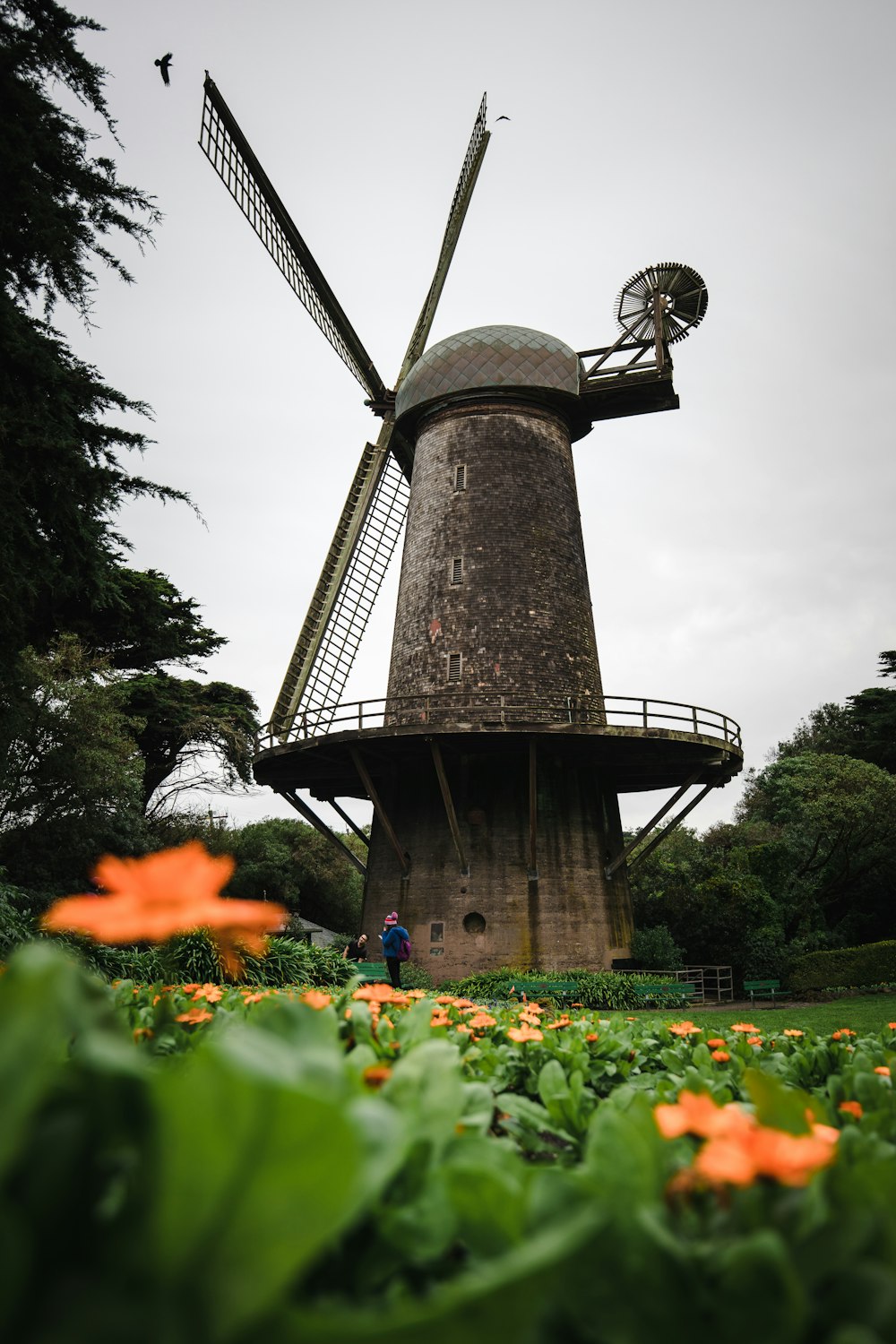 brown and black tower under gray cloudy sky