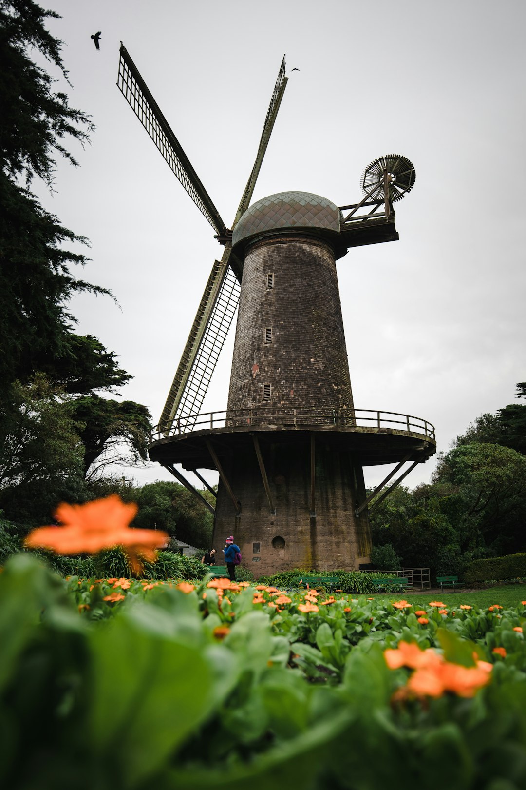 brown and black tower under gray cloudy sky