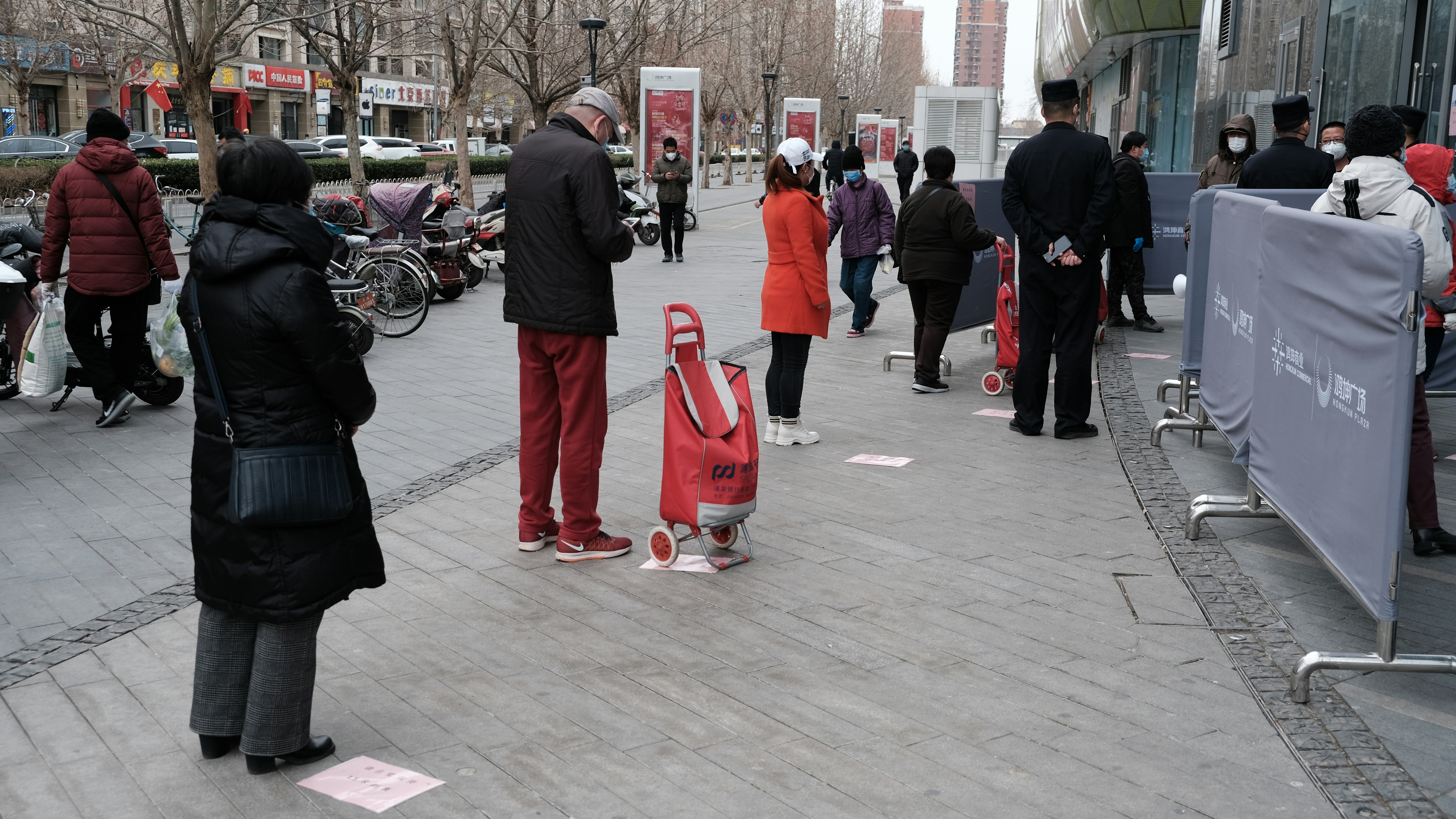 people walking on sidewalk during daytime