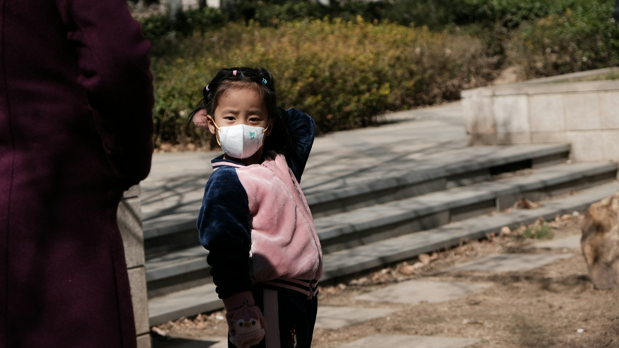 Coronavirus COVID-19, facemask ,china ,outside,Chinese little girl,upset,community