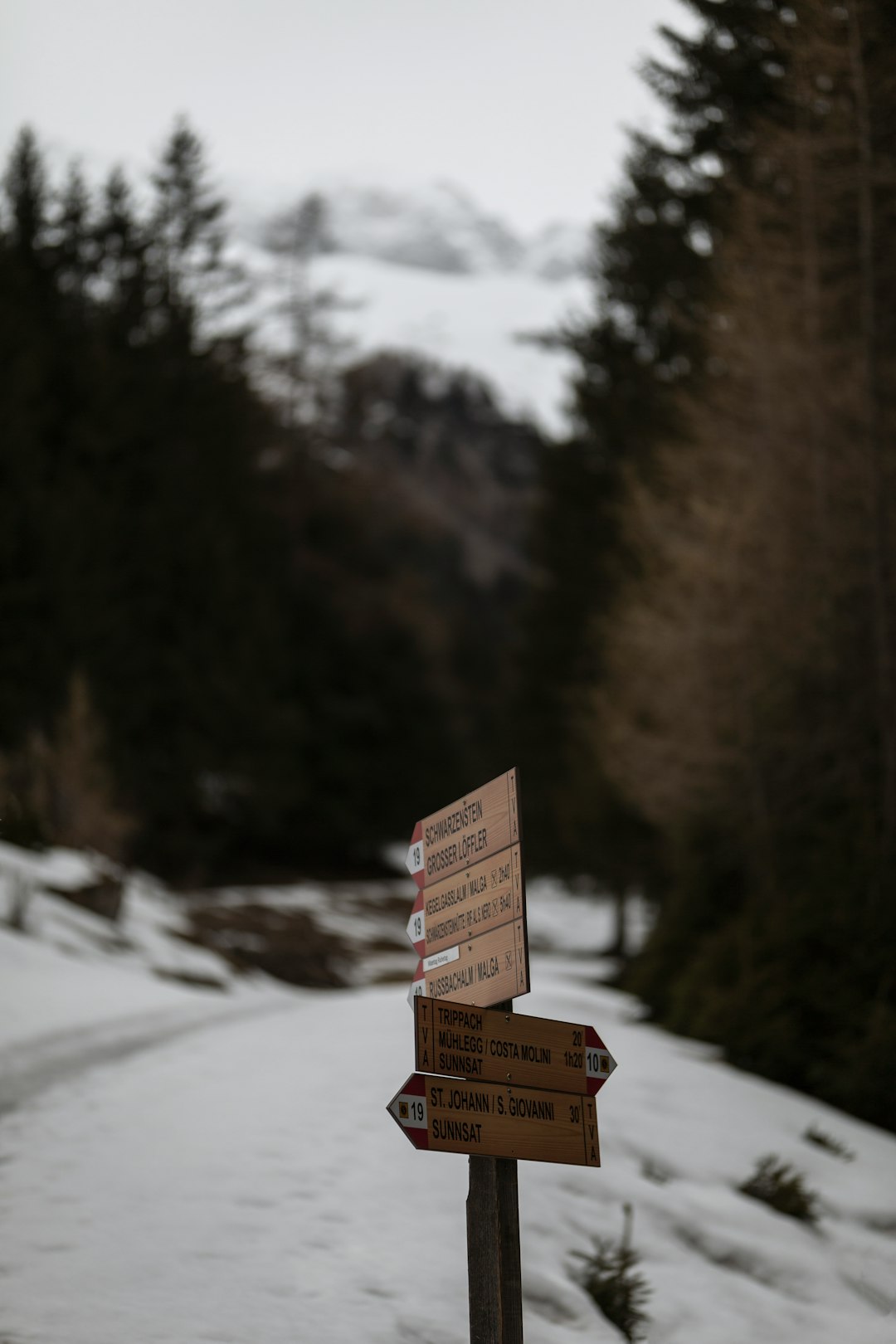 brown wooden box on snow covered ground