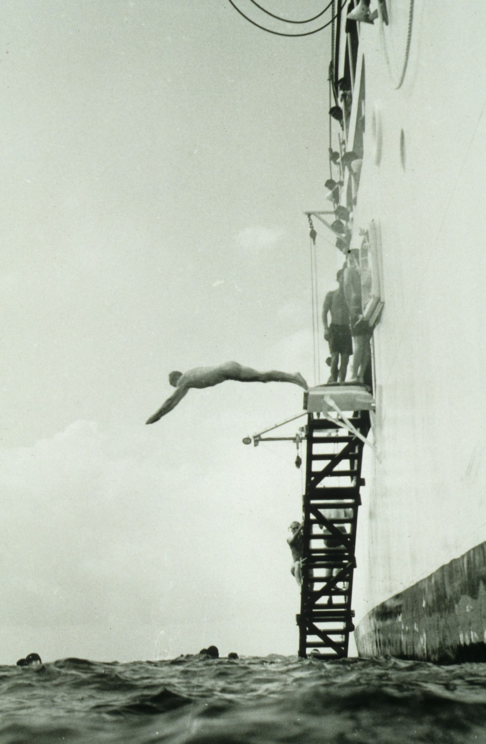 woman in white dress on black metal tower