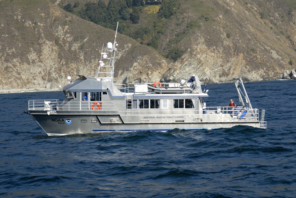 white and black ship on sea during daytime