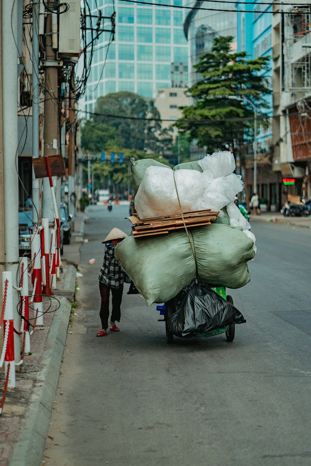 white plastic bags on sidewalk during daytime