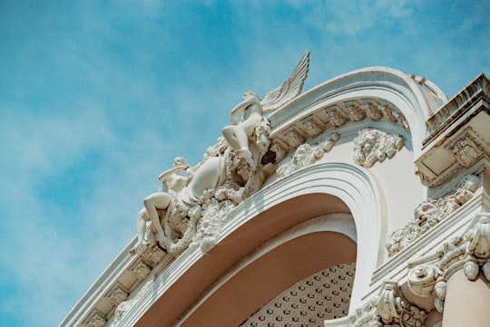 white concrete building under blue sky during daytime in Opera Vietnam