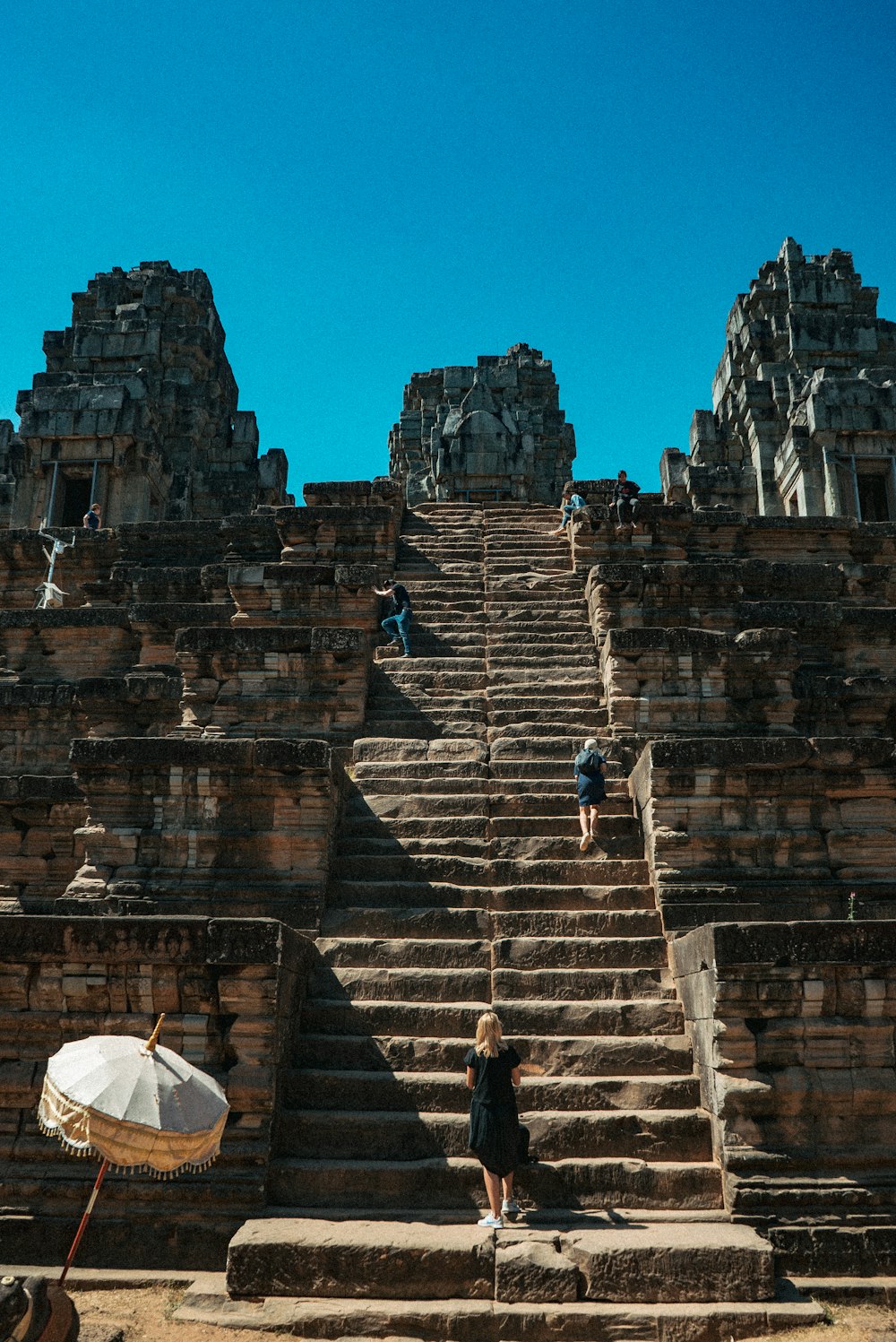 man in black jacket standing on stairs