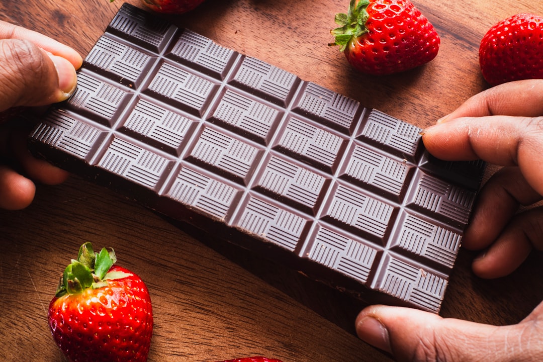 red strawberry on brown wooden table