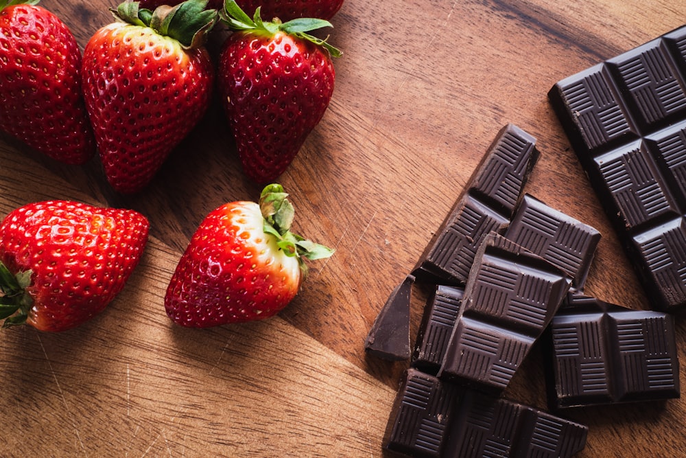 strawberries on brown wooden table