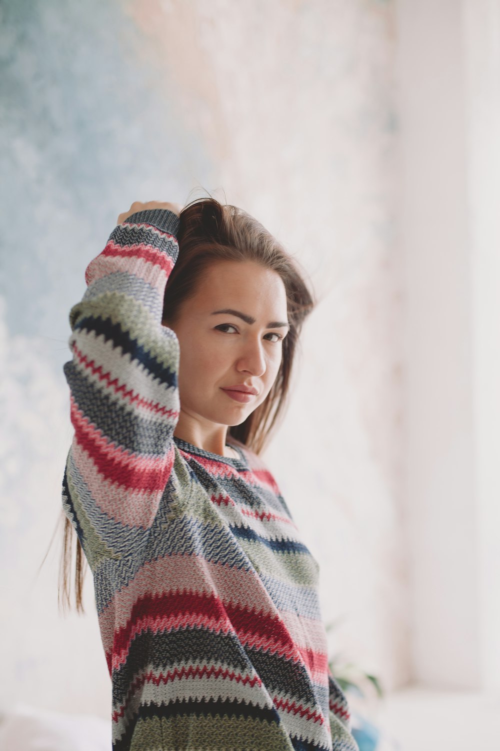 woman in red and white striped knit sweater