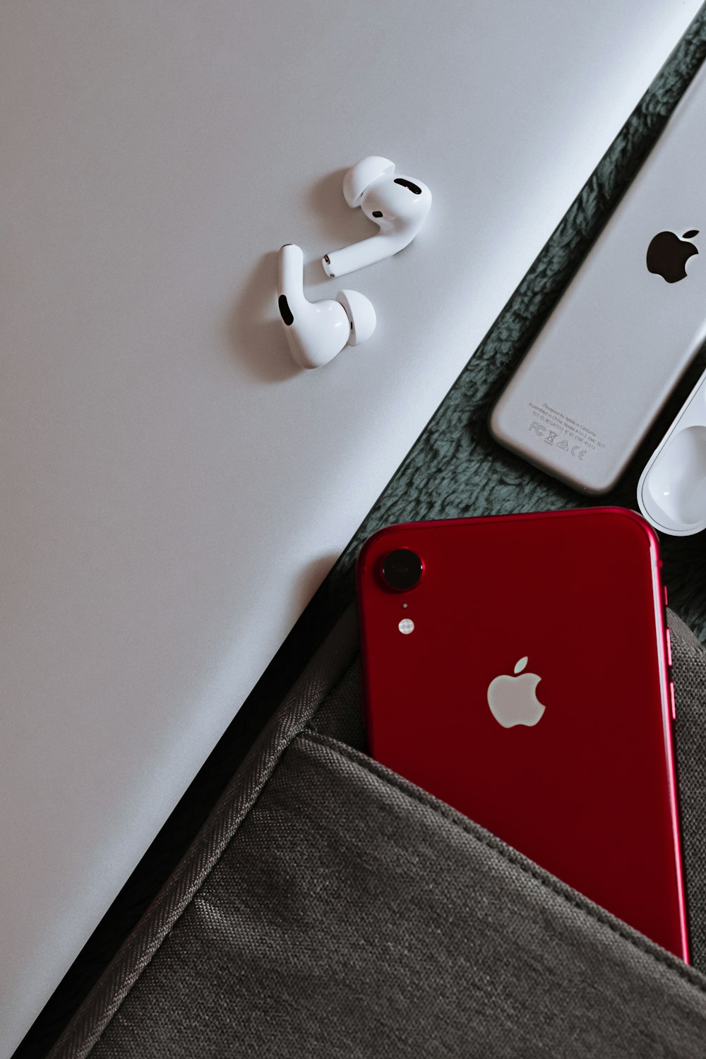 red iphone 7 on white table