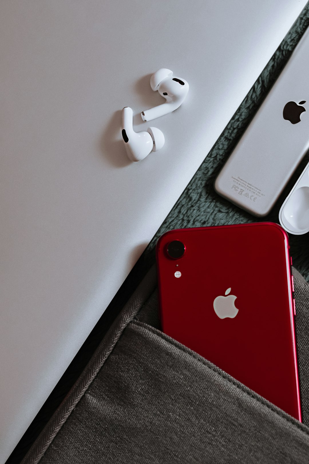 red iphone 7 on white table