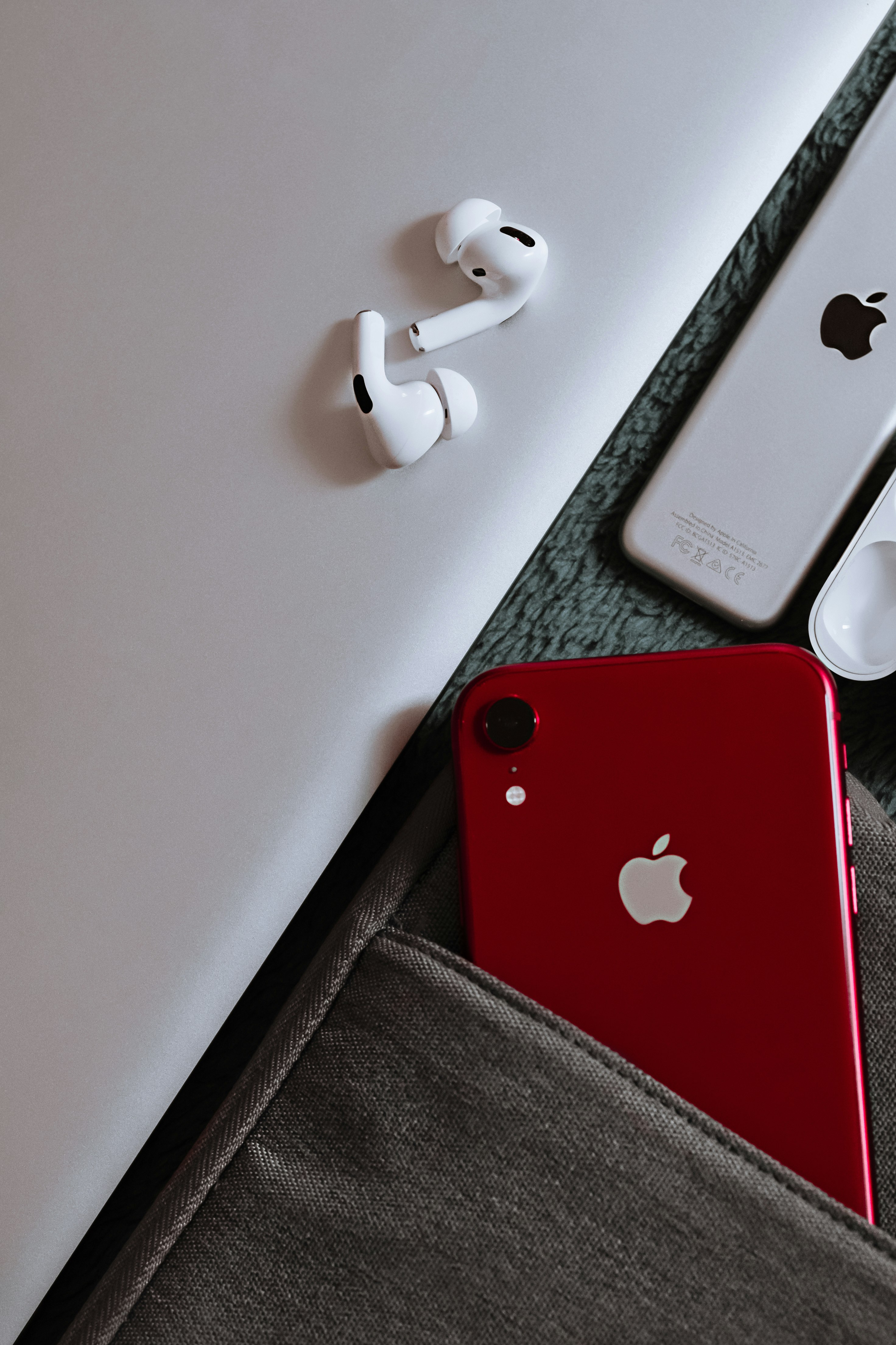 red iphone 7 on white table