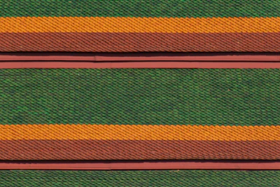 Neatly arranged roofing tiles showcasing color and texture variety.