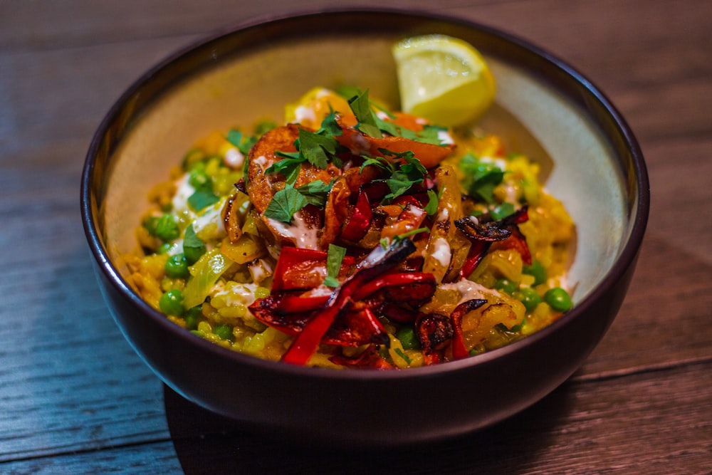 vegetable salad on black ceramic bowl