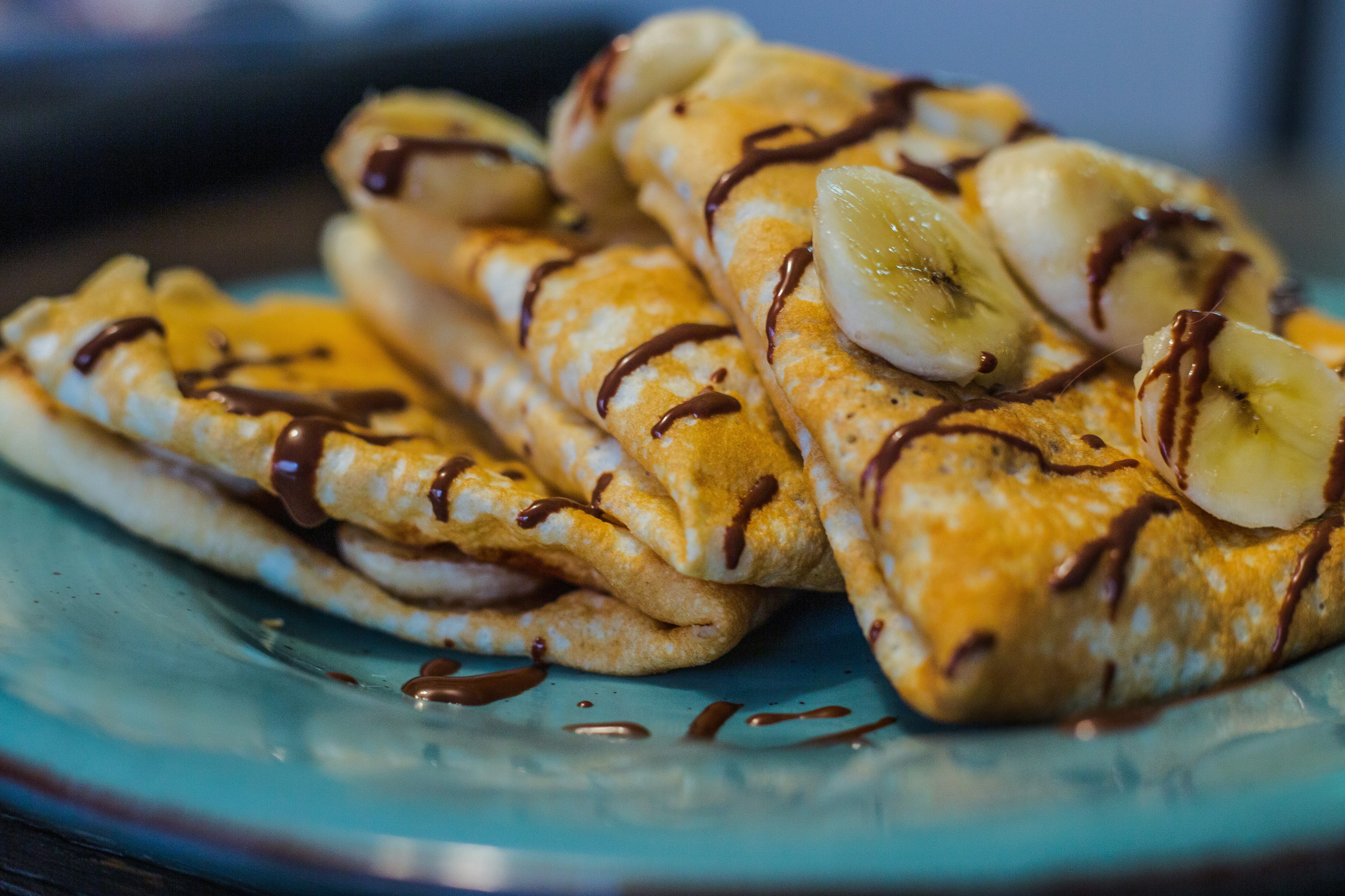 brown and white pastry on blue round plate