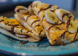 brown and white pastry on blue round plate