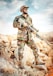 man in green and brown camouflage uniform holding rifle