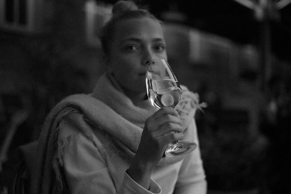 grayscale photo of man drinking water