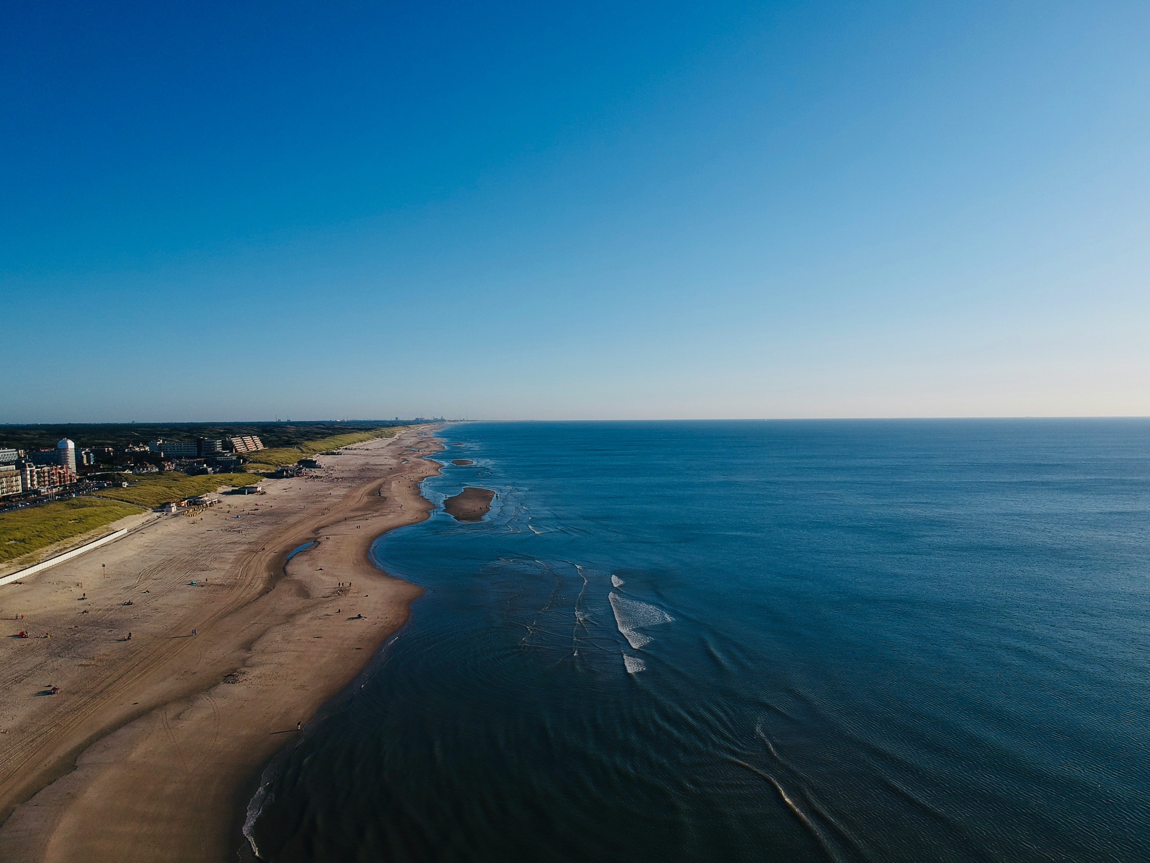 blue sea under blue sky during daytime