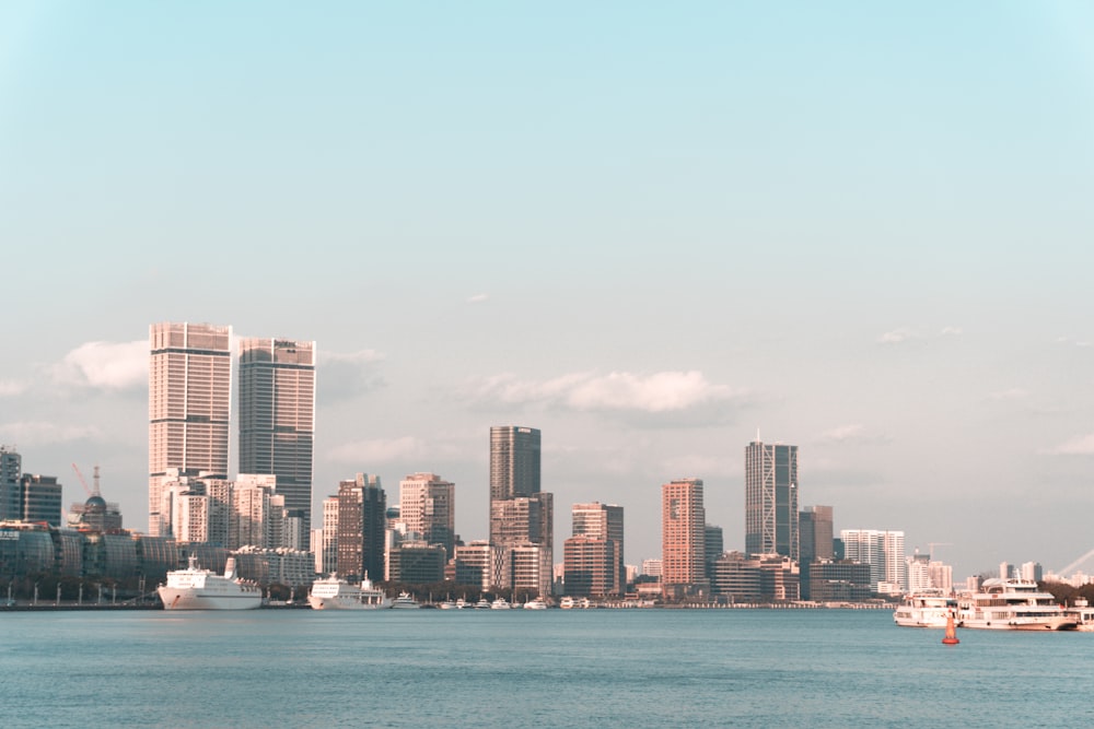 city skyline across body of water during daytime