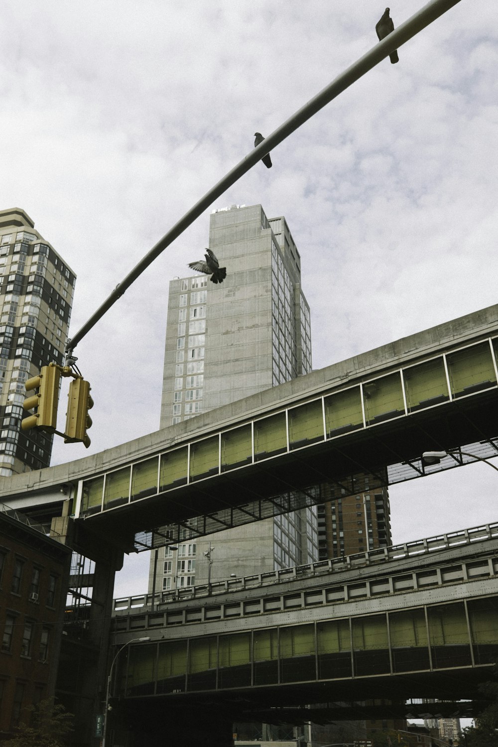 gray concrete building under white clouds during daytime