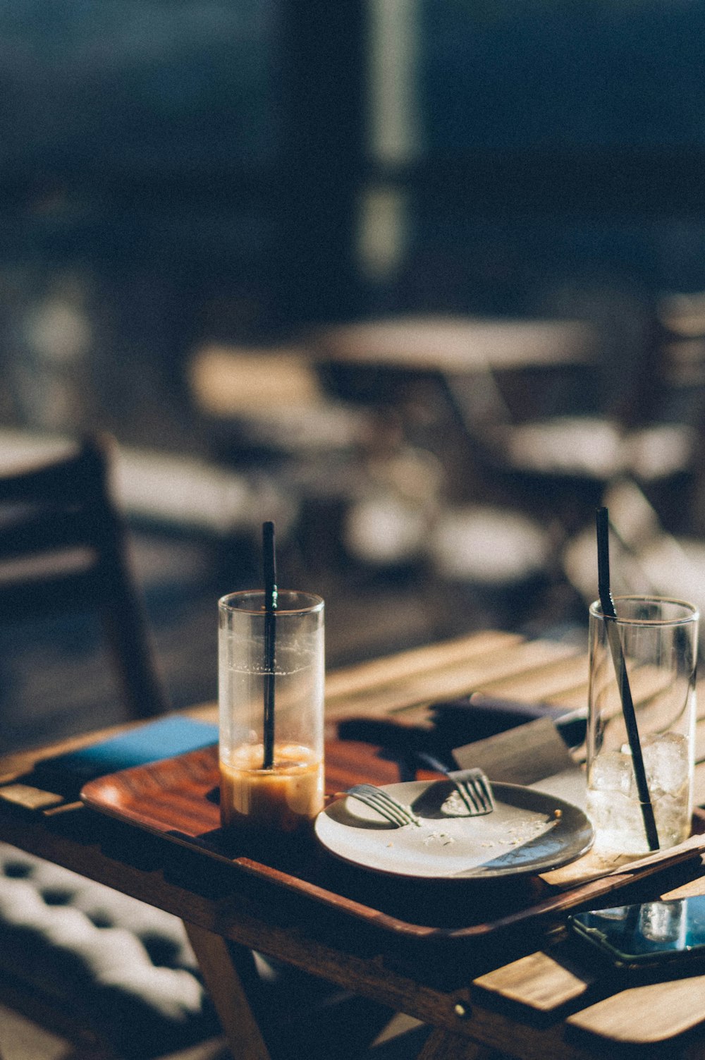 clear drinking glass on brown wooden table