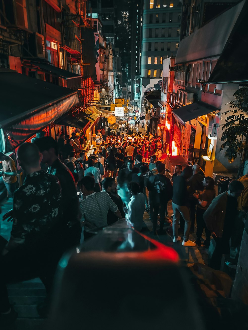 people walking on street during night time