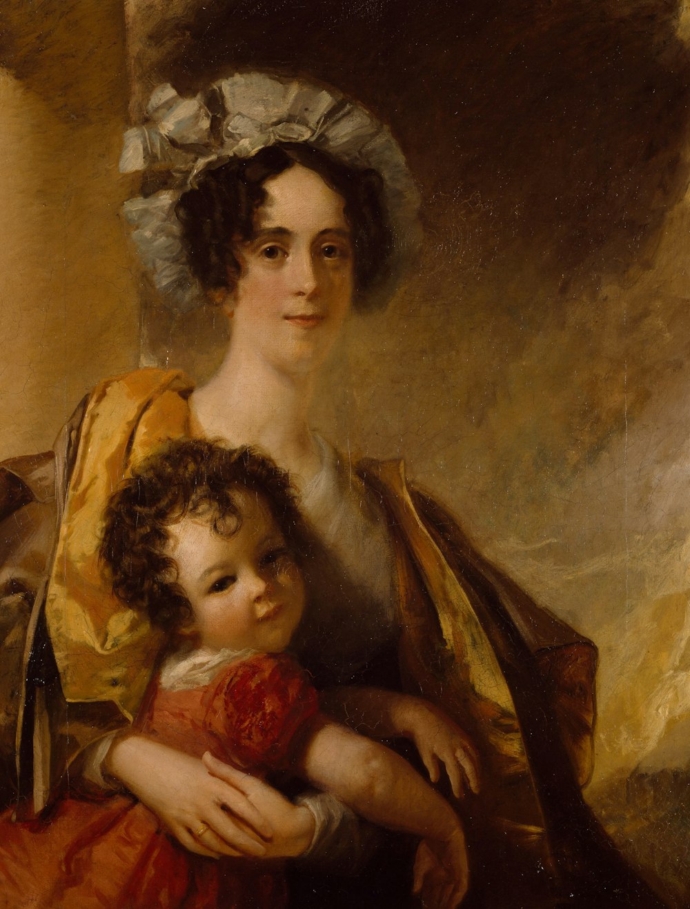 woman carrying baby in red and white dress