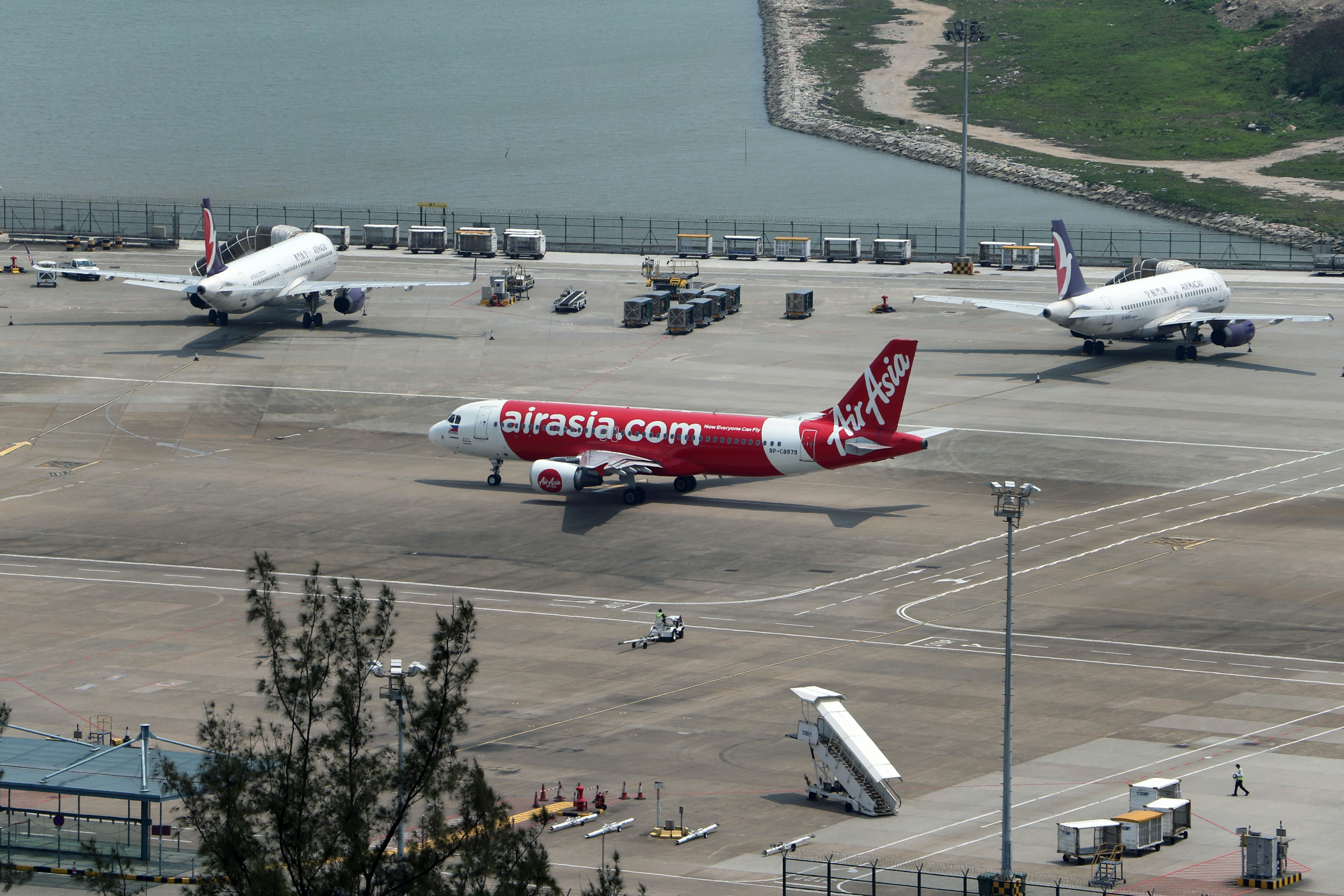 white and red airplane on airport during daytime