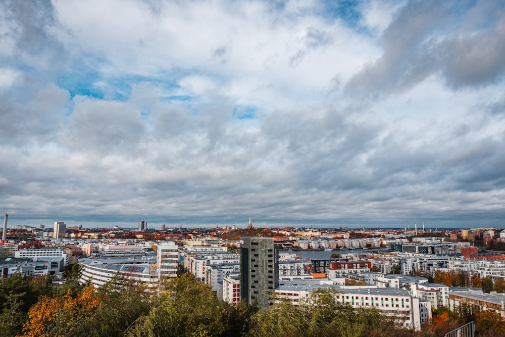 city buildings under cloudy sky during daytime