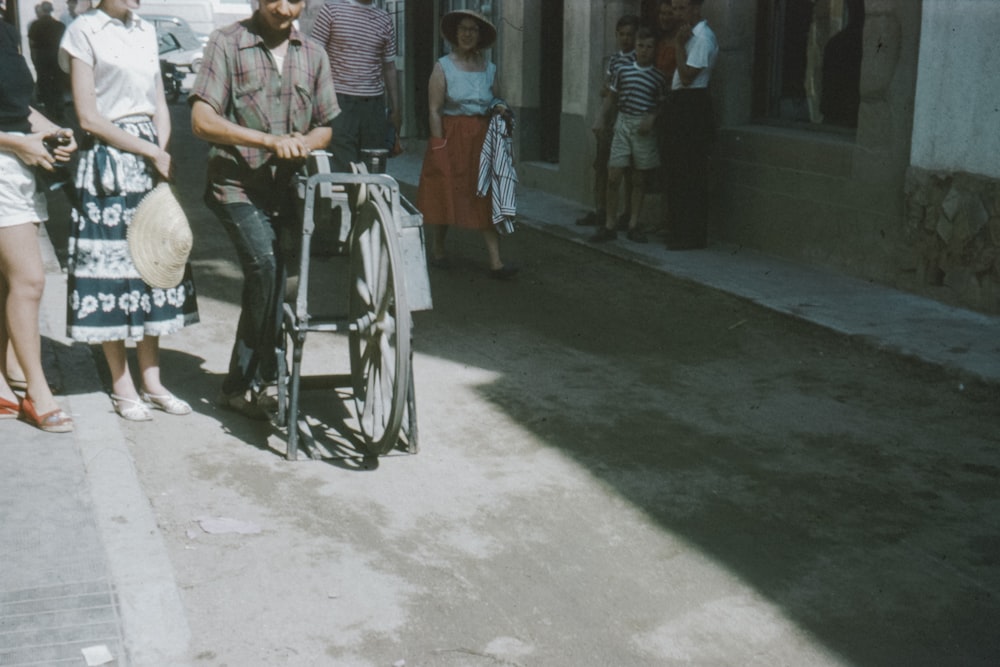 man in gray polo shirt sitting on black wheelchair