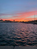 A picturesque harbor at dusk where the ship moors after a day of swimming and exploration.