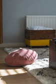 pink and white pillow on white and red floral bed linen