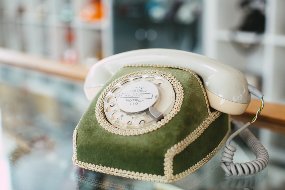 white and green rotary phone