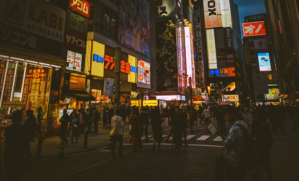 people walking on street during night time