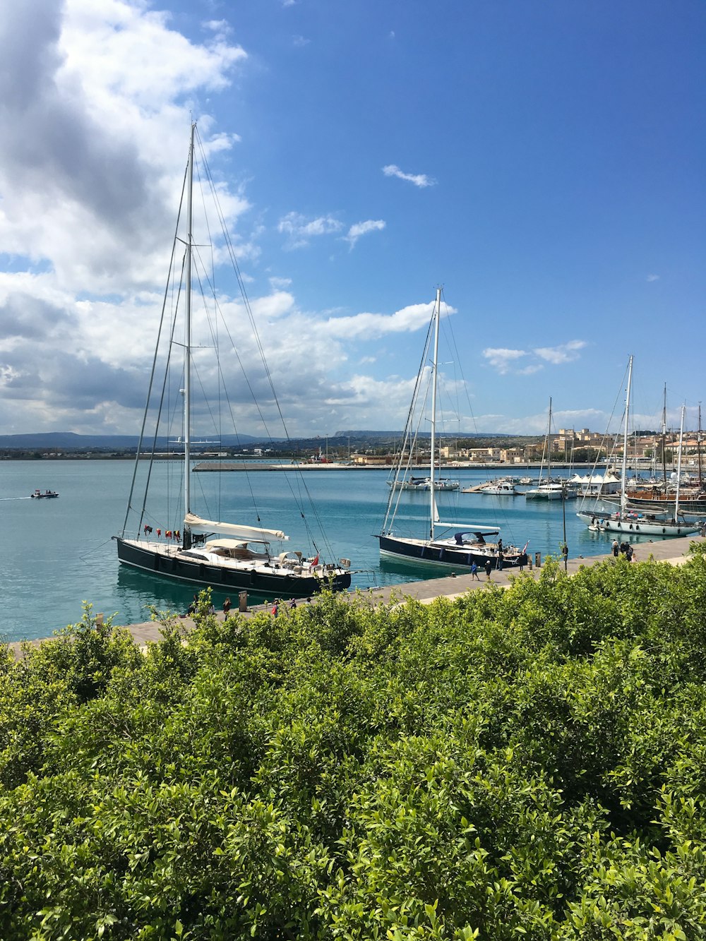 white and brown boat on sea during daytime