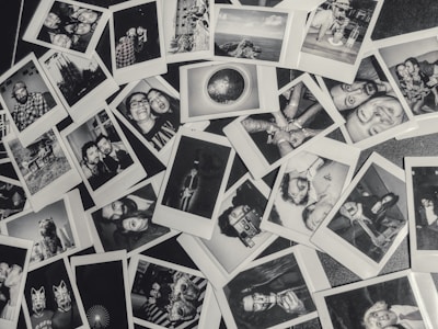 A vibrant collage of travelers smiling, capturing candid moments in diverse landscapes under a moody dark theme.