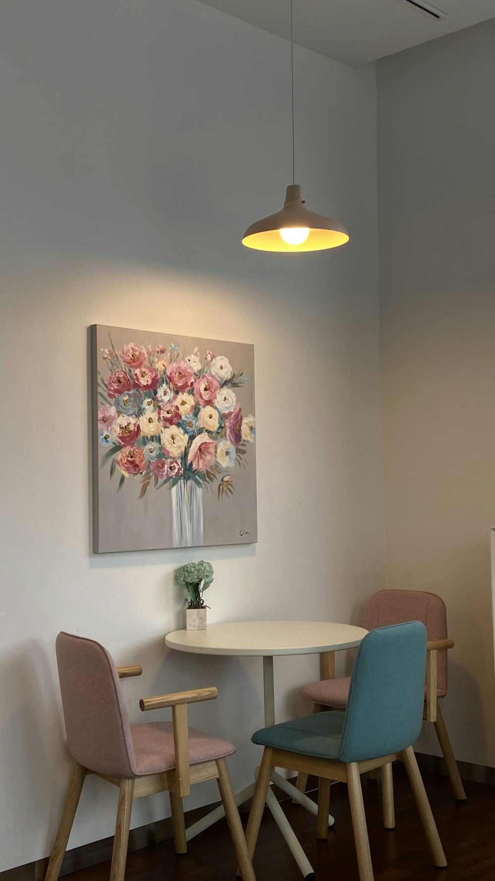 white and pink flower painting on wall