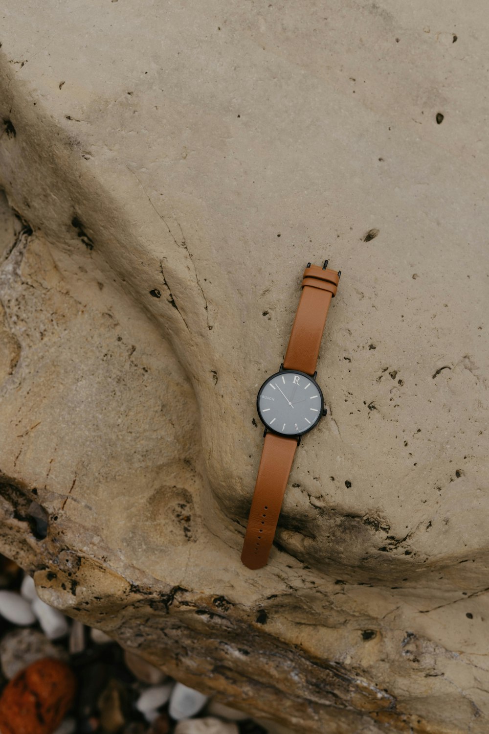 brown leather strap silver round analog watch