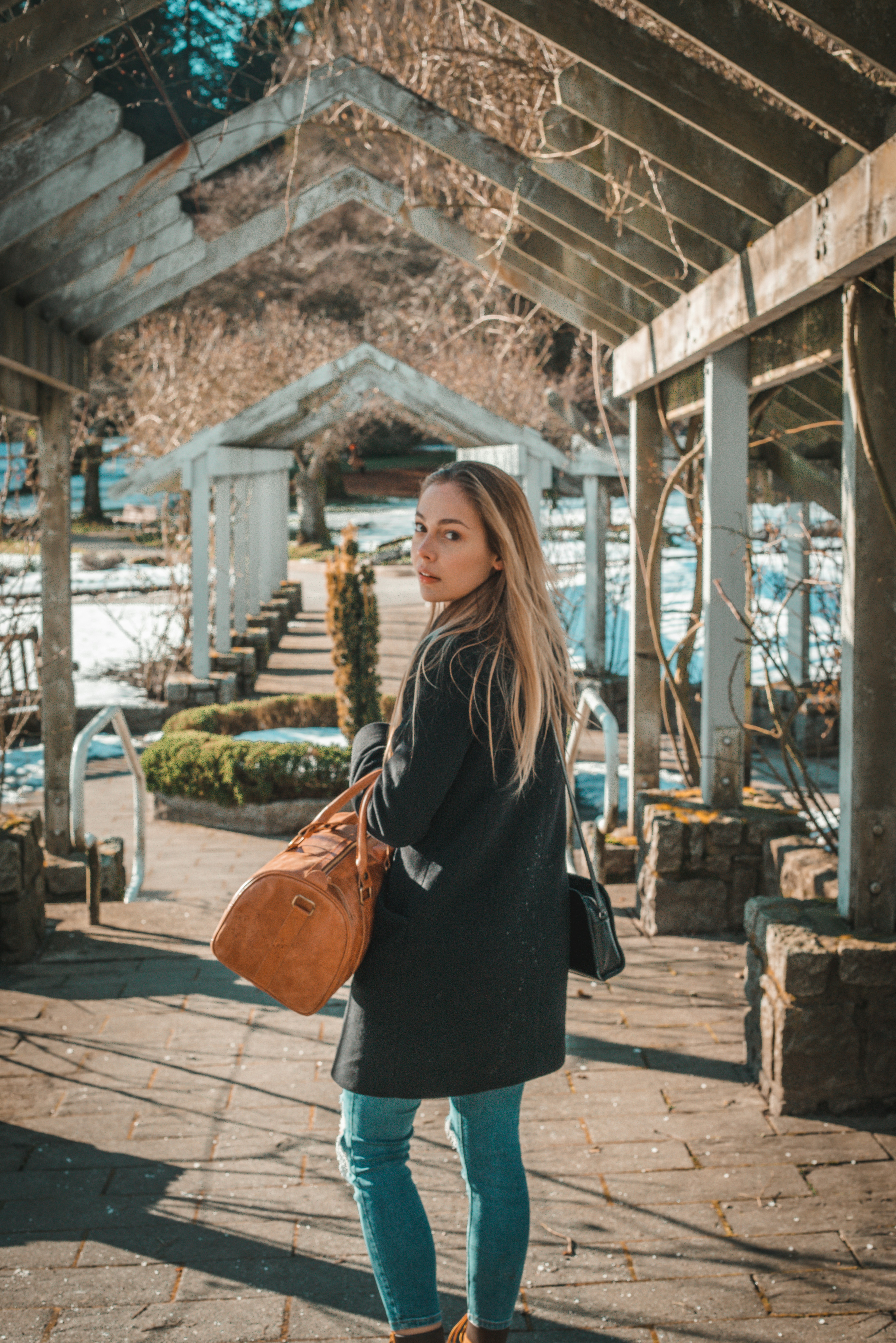 Sony a7R + Canon EF 50mm F1.8 II sample photo. Woman in black coat photography