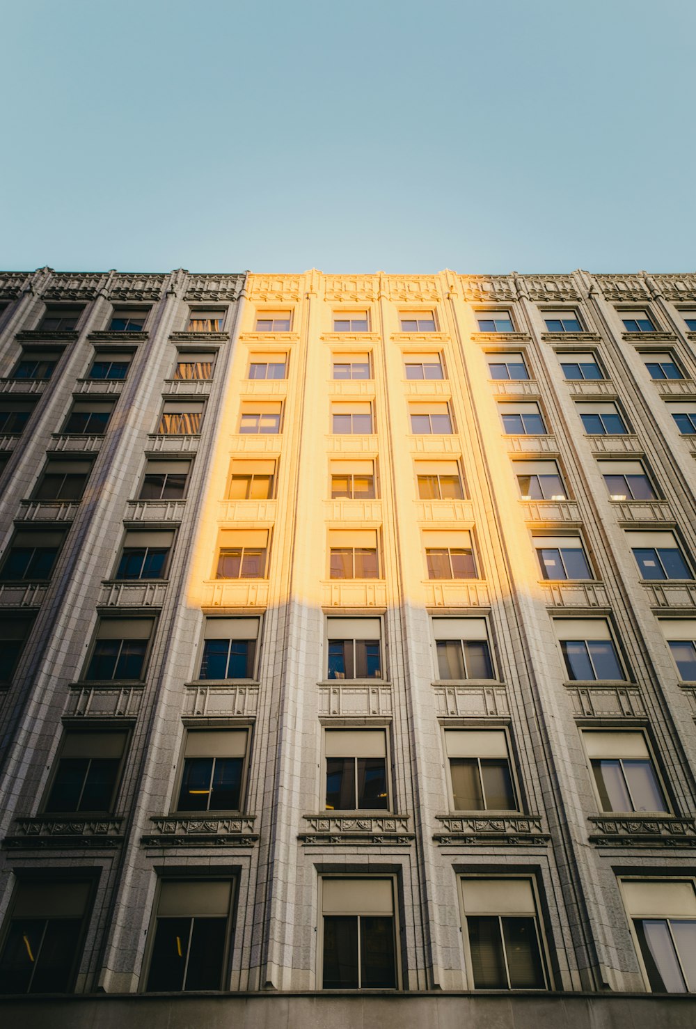 white concrete building under blue sky during daytime