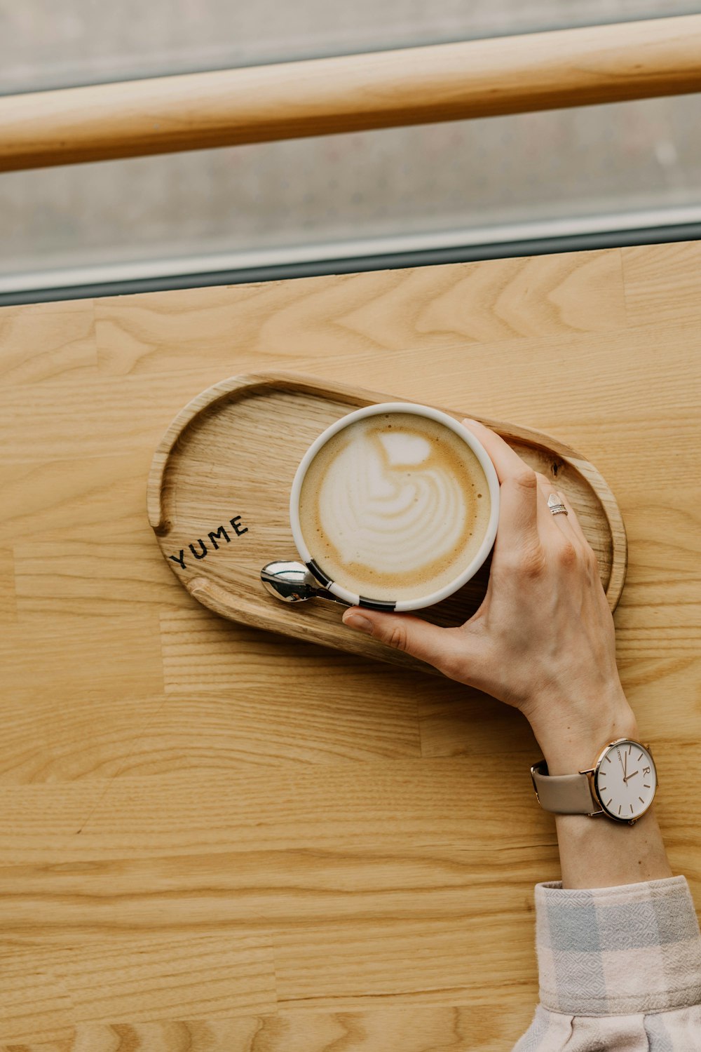 person holding white ceramic mug with coffee