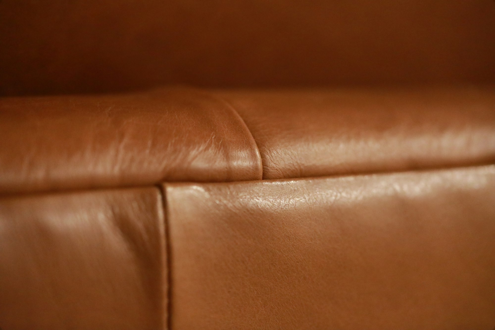 Close-up of tan leather.  West Elm couch.  