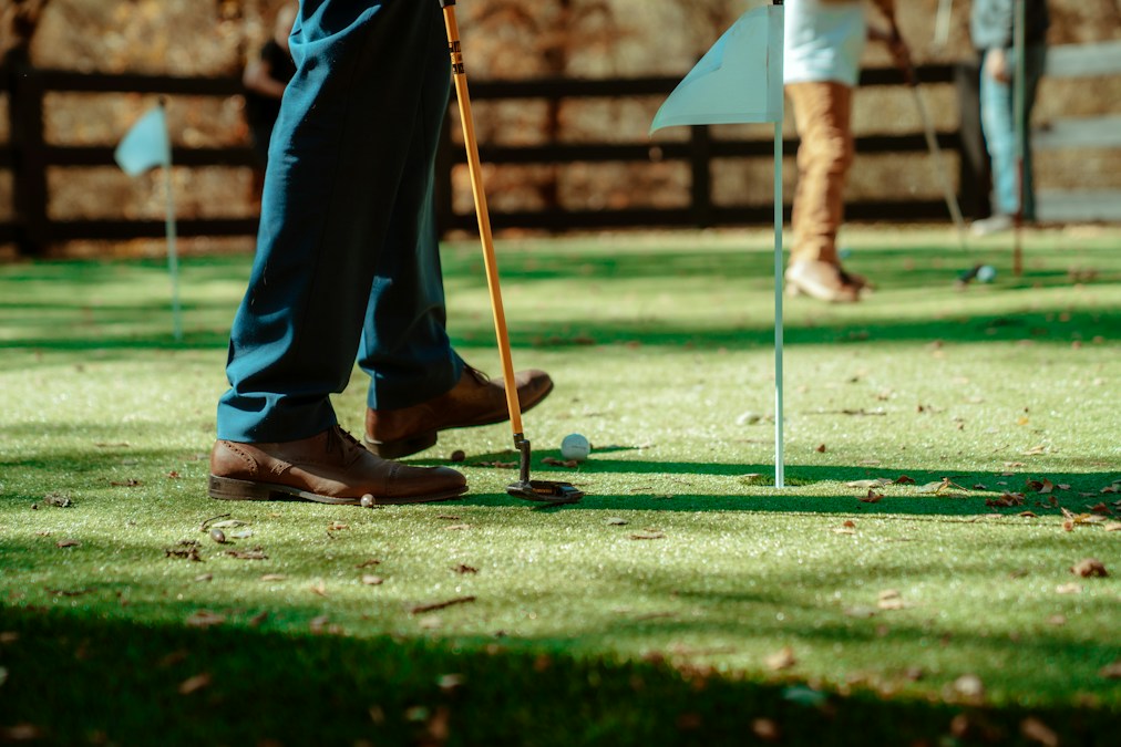Colorful mini golf course with obstacles and putting green