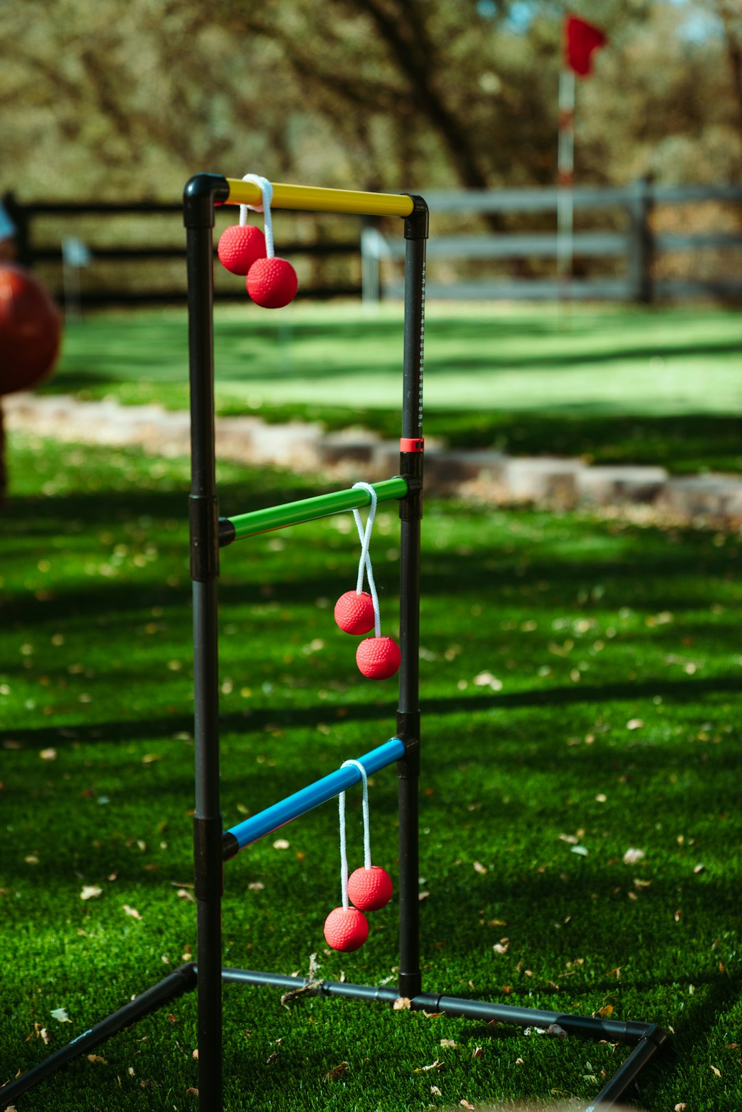 red and green metal frame on green grass field during daytime