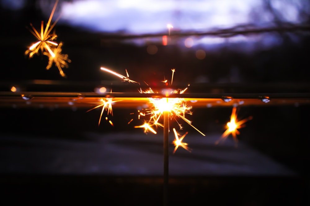 yellow fireworks in the sky during night time