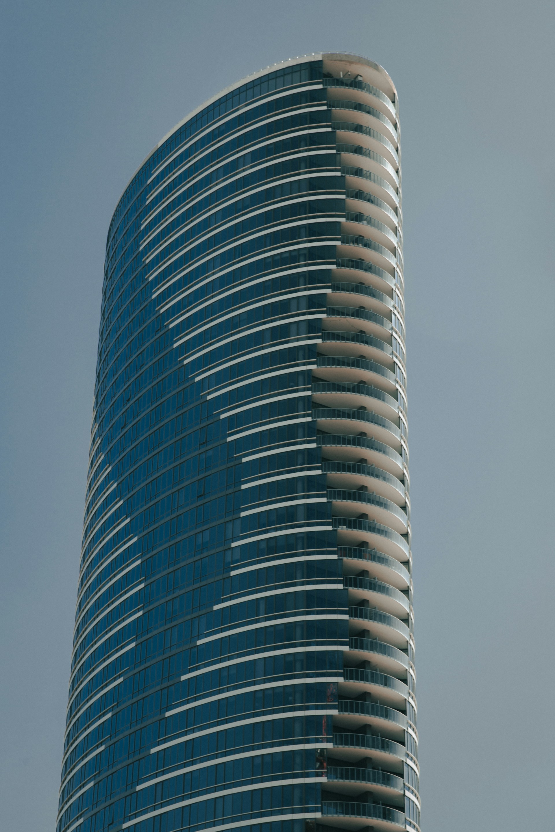 blue glass walled high rise building