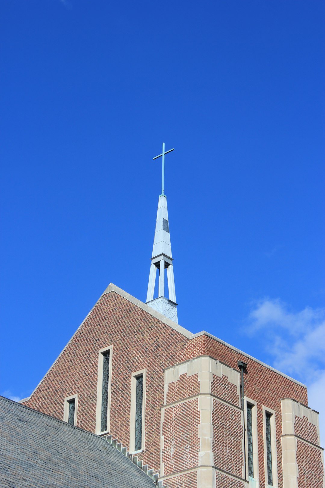 brown and white concrete church under blue sky during daytime