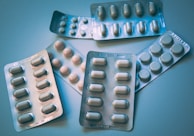 white and blue medication pill blister pack